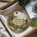 A decorative ornament with a scenic landscape of DeSoto State Park, Alabama, featuring a waterfall, bridge, and pine trees.