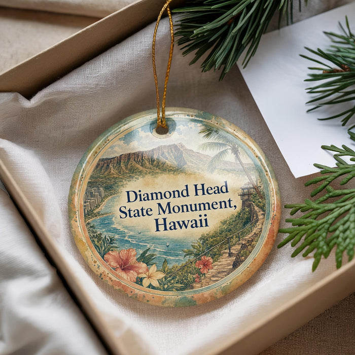 A decorative ornament with a scenic image of the Diamond Head State Monument in Hawaii, hanging from a string.