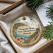 A decorative ornament with a scenic image of the Diamond Head State Monument in Hawaii, hanging from a string.