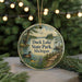 A circular ornament featuring a scenic landscape of Duck Lake State Park, Michigan, with a duck swimming in the foreground and a path leading to the lake.