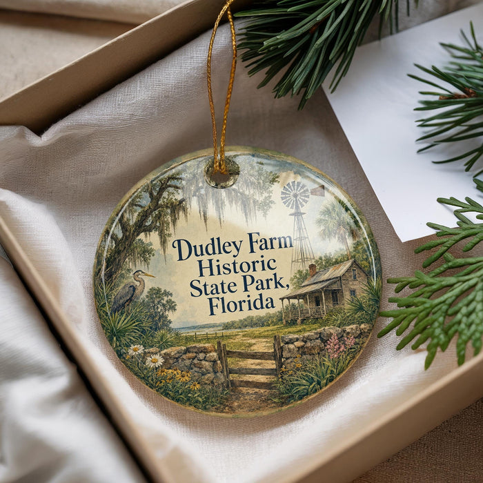 A decorative ornament with a scenic image of Dudley Farm Historic State Park, Florida, hanging from a string.