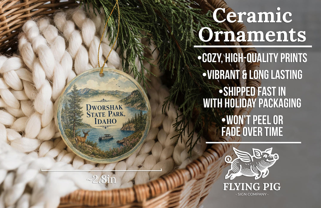 Ceramic ornaments, featuring a scenic image of Dworshak State Park, Idaho, hanging from a wicker basket.