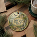 A round ornament with a scenic image of Eagle Creek State Park, Illinois, featuring a bird, a waterfall, and a bridge.