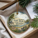 A decorative ornament with a scenic view of East Tawas City Park, Michigan, featuring a gazebo, bench, and flowers.