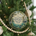 A round ornament hanging on a Christmas tree, featuring a scenic image of Edward Ball, Wakulla Springs, and State Park, Florida.