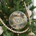 A round ornament hanging on a Christmas tree, featuring a scenic image of Egmont Key State Park in Florida.