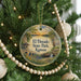 A round ornament on a Christmas tree, featuring a scenic landscape with a bridge and a waterfall, with the text "El Dorado State Park, Kansas" displayed prominently.