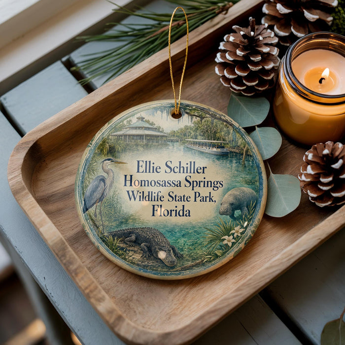 A wooden tray with a decorative ornament featuring a bird, a beaver, and a waterfowl, along with pine cones and a lit candle.