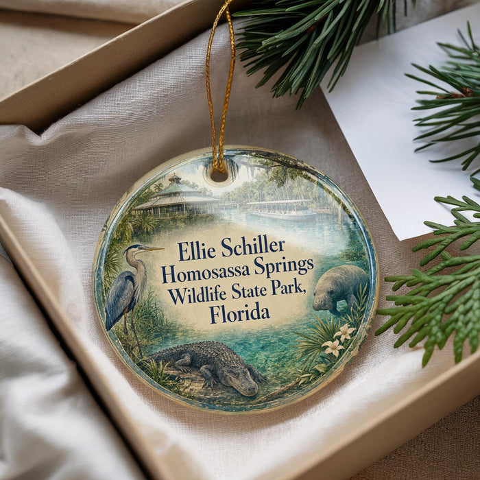 A round ornament with a bird, alligator, and text that says "Ellie Schiller Homosassa Springs Wildlife State Park, Florida".