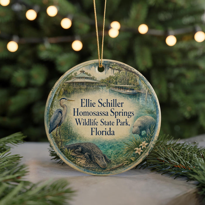 A circular ornament featuring a bird, alligator, and a palm tree, with text that reads "Ellie Schiller Homosassa Springs Wildlife State Park, Florida".