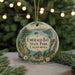 A round ornament with a scenic landscape of Emerald Bay State Park, California, featuring a castle, waterfall, and pine trees.
