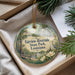An ornament in a box, featuring a scenic image of Fairview-Riverside State Park in Louisiana.