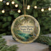 A round ornament with a scenic image of Fanning Springs State Park, Florida, featuring a bird, palm trees, and a body of water.