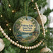 A circular ornament hanging on a Christmas tree, featuring a scenic image of Fish Trap Lake State Park, Kentucky.