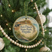 A round ornament hanging on a Christmas tree, featuring an illustration of Fort Clinch State Park in Florida.