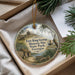 A decorative ornament with a painting of Fort King George Historic Site in Georgia, featuring a house, a boat, and a forest.