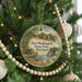 A round ornament hanging on a Christmas tree, featuring an illustration of Fort Washington State Park, Maryland.