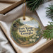 A round ornament with a scenic image of Fort Yargo State Park, Georgia, hanging from a string.
