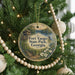 A round ornament hanging on a Christmas tree, featuring a scenic image of Fort Yargo State Park in Georgia.