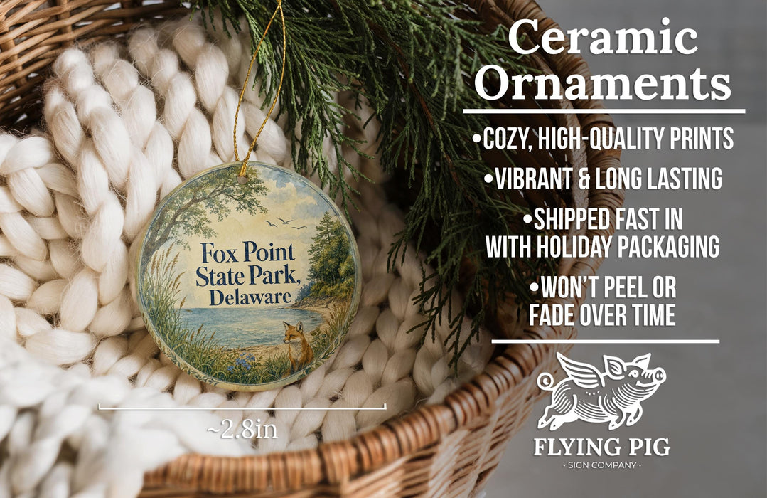 Ceramic ornaments, featuring a design of a scenic view of Fox Point State Park, Delaware, hanging in a wicker basket.