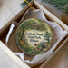 A decorative ornament in a box, featuring a scenic image of Gebhard Woods State Park, Illinois.