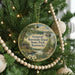 A round ornament hanging on a Christmas tree, featuring a scenic image of General Burnside Island State Park, Kentucky.