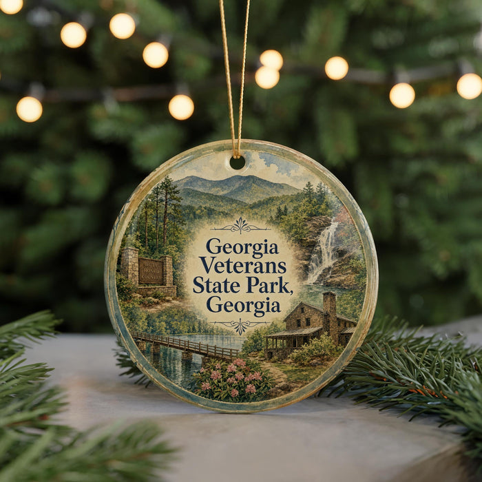 A round ornament featuring a scenic image of Georgia Veterans State Park, with a bridge and waterfall in the background.