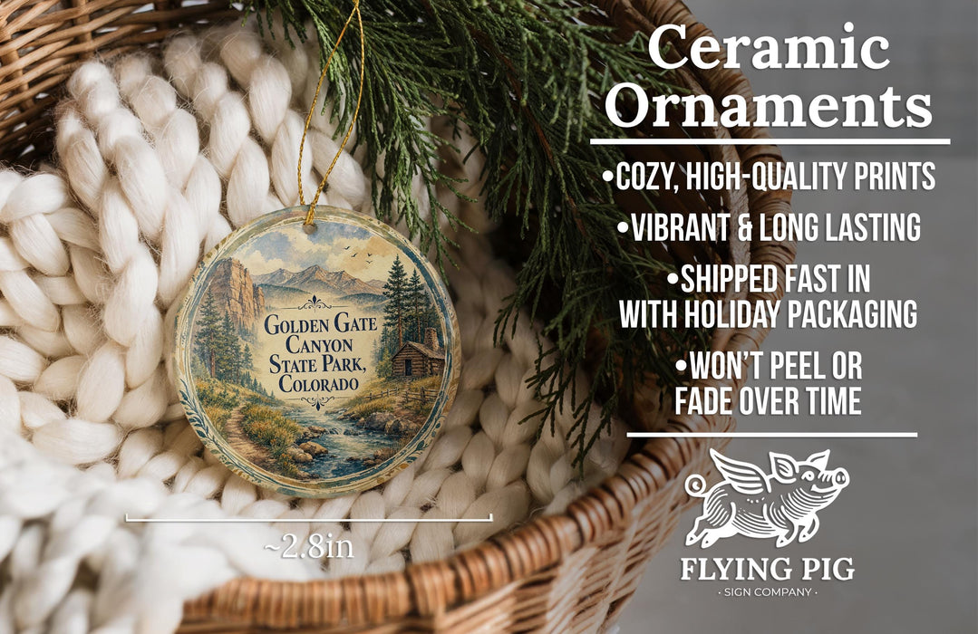 Ceramic ornaments, featuring a scenic image of the Golden Gate Canyon State Park in Colorado, are displayed in a woven basket.