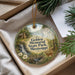 A decorative ornament with a scenic image of Golden Memorial State Park, Mississippi, featuring a cabin, waterfall, and deer.