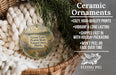 Ceramic ornaments, featuring a design of a lake and prairie state natural area, are displayed in a basket.