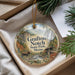 A decorative ornament with a scenic image of a forest and a waterfall, featuring the text "Grafton Notch State Park, Maine".