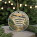 A decorative ornament featuring a lighthouse and a scenic landscape, with the text "Grand Haven State Park, Michigan" displayed prominently.