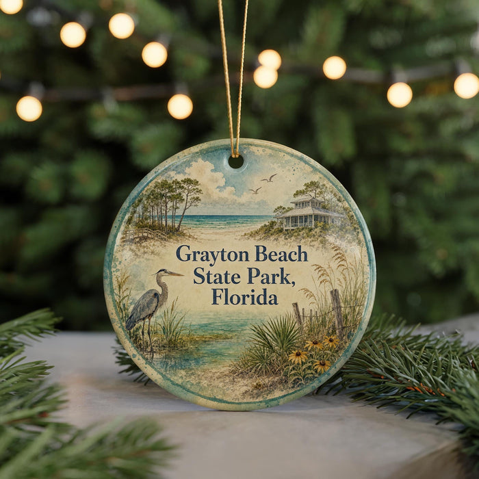 A round ornament with a beach scene and a bird, featuring the text "Grayson Beach State Park, Florida" on it.