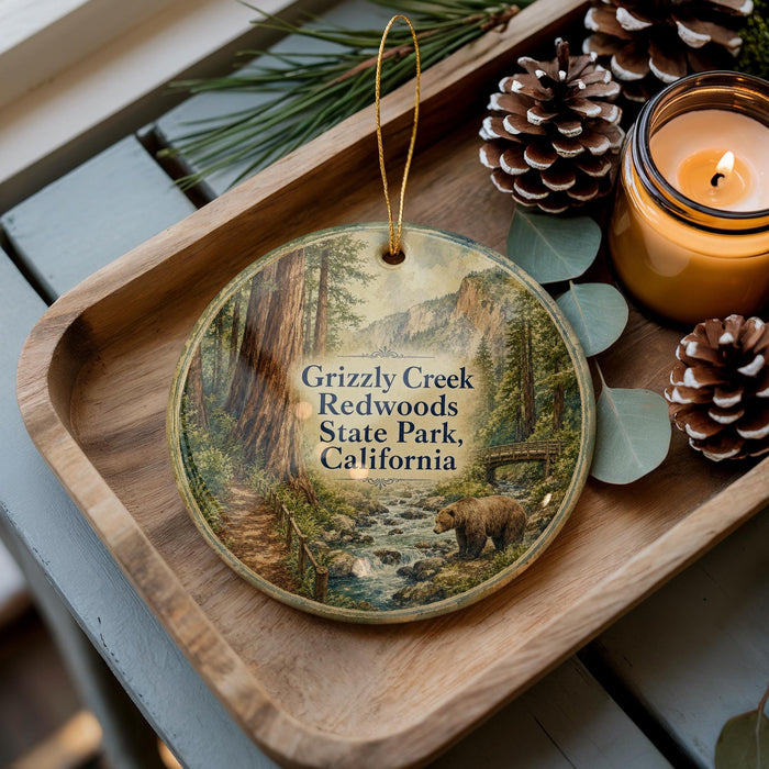 A wooden tray with a decorative ornament featuring a scenic image of Grizzly Creek, Redwoods State Park, California, and a bear in the foreground.