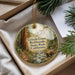 A round ornament with a scenic image of Grizzly Creek, a redwood forest in California, featuring a bear walking along a stream.