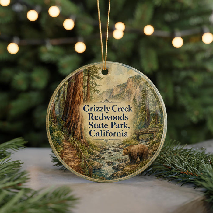 A round ornament featuring a scenic image of Grizzly Creek in Redwoods State Park, California, with a bear walking along a stream.