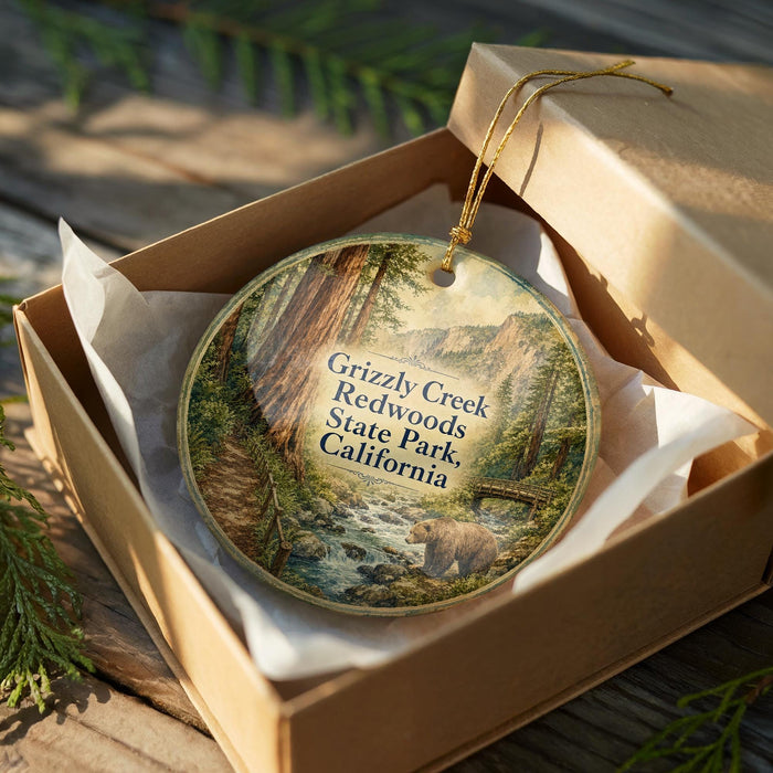 A wooden box containing a decorative ornament with a scenic image of Grizzly Creek and Redwoods State Park in California.