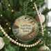 A round ornament hanging on a Christmas tree, featuring a scenic image of a lake and surrounding landscape, with the text "Gull Point State Park, Iowa" displayed prominently.