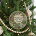 A round ornament on a Christmas tree, featuring a scenic image of Hamburg State Park in Georgia, with a bird in the foreground and a bridge in the background.