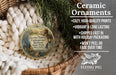 Ceramic ornaments, featuring a vintage-style design with a lantern and a scenic background, are displayed in a wicker basket.