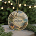 A round ornament featuring a scenic image of Hearst San Simeon State Park, California, with a seal resting on the beach and palm trees in the background.