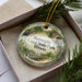 A decorative ornament in a box, featuring a scenic image of Hennepin Canal State Park, Illinois.