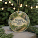 A round ornament with a scenic image of Hennepin Canal State Park, Illinois, hanging from a string.
