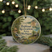 A round ornament with a scenic landscape of a mountain, river, and cabin, surrounded by greenery and trees, with the text "Highland Recreation Area, Michigan" displayed prominently.