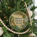A round ornament hanging on a Christmas tree, featuring a scenic image of the Highlands Hammock State Park in Florida.