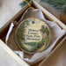 A round ornament in a box, featuring a scenic image of Holmes County State Park in Mississippi.