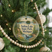 A round ornament hanging on a Christmas tree, featuring a scenic image of Indian Lake State Park, Michigan.