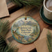 A decorative ornament featuring a scenic landscape of Jackson Lake, State Park, Colorado, with pine trees and mountains in the background.