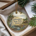 A decorative ornament with a scenic landscape of Jacksonport State Park, Arkansas, featuring a bird, a cabin, and a river.