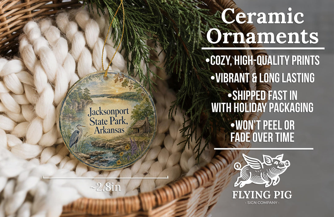 Ceramic ornaments, featuring a detailed image of a scenic landscape with a bird, are displayed in a woven basket.